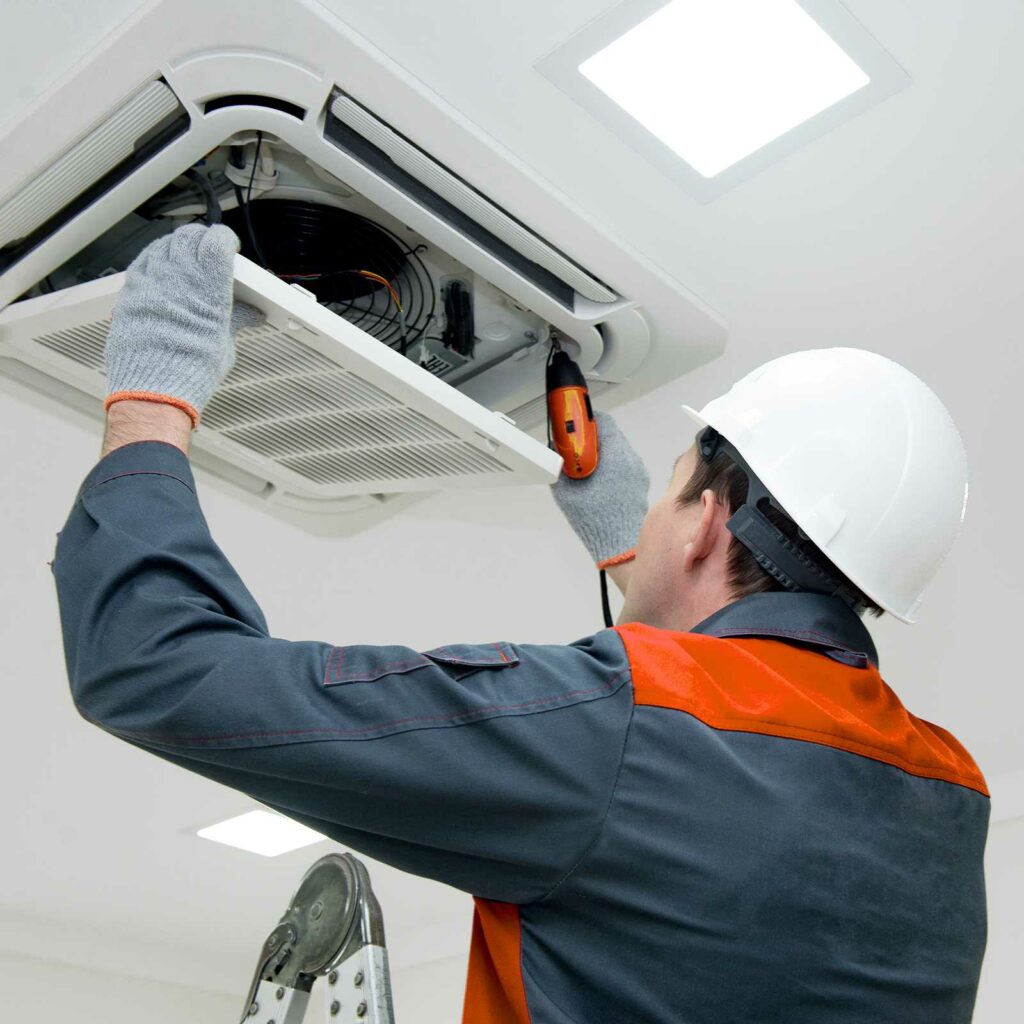 A worker of Innovative Mechanical Solutions replacing the cooling system of a house in Boise ID - IMS365HVAC